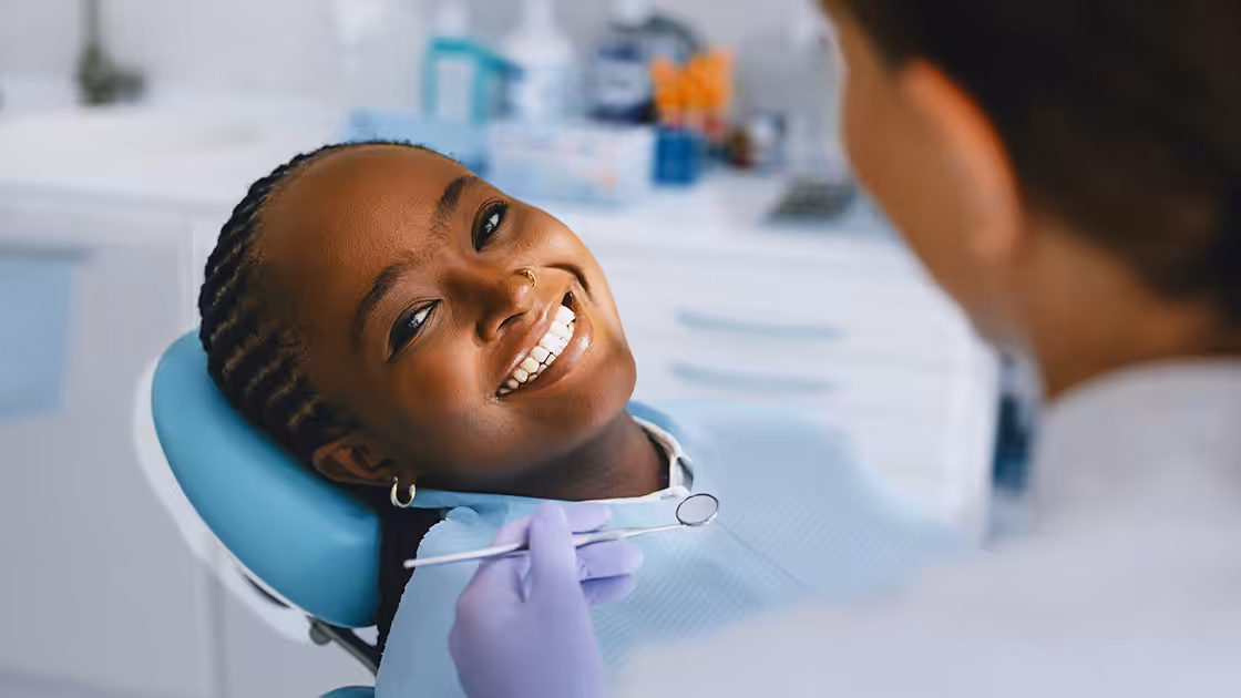 Smiling woman in dentist chair